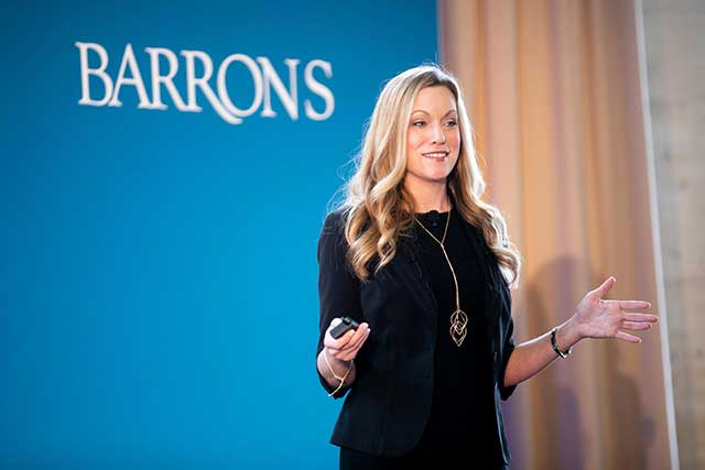 Dr. Melissa Milanak giving a keynote speech for Barron's